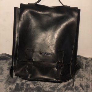 Dr. Marten genuine leather flap-open back back.